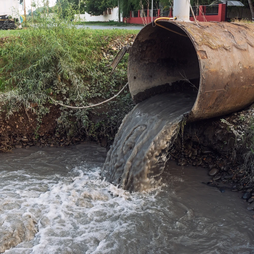 Picture of environmental waste flowing into body of water