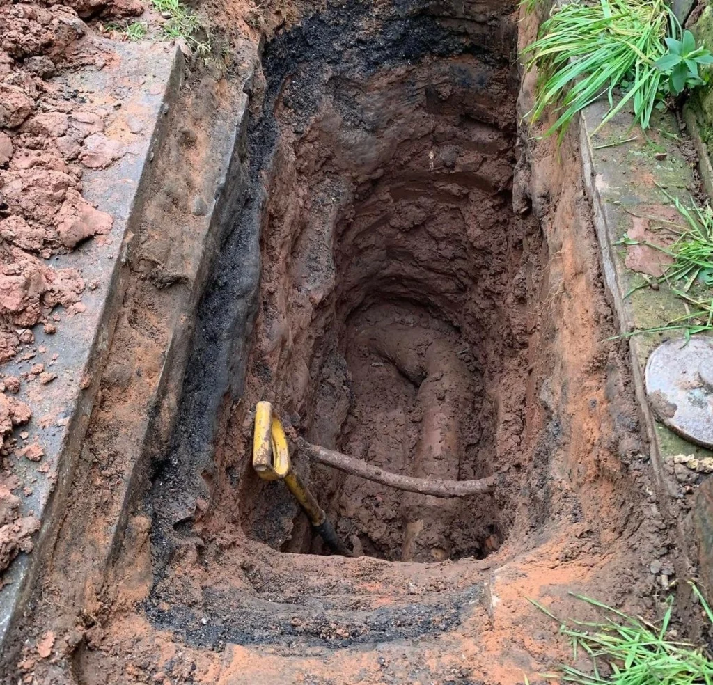 Photo of a dug hole to a damage pipe