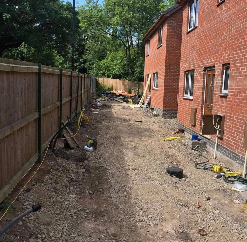 Picture of a housing development after pipe work trench has been filled in