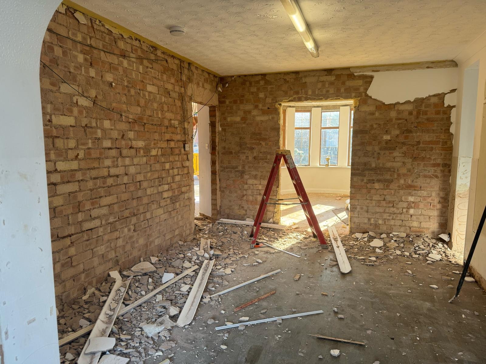 Removed all internal plasterboard and ceilings to expose original brickwork.